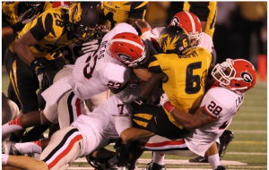 Mizzou's Marcus Murphy is hammered by Georgia defenders on a punt return.