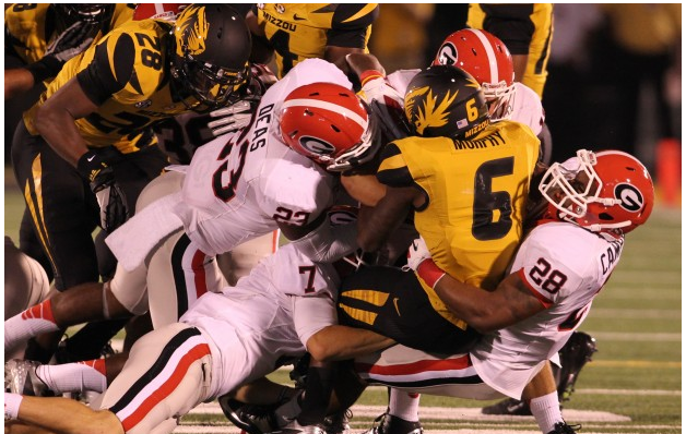 Mizzou's Marcus Murphy is hammered by Georgia defenders on a punt return. 